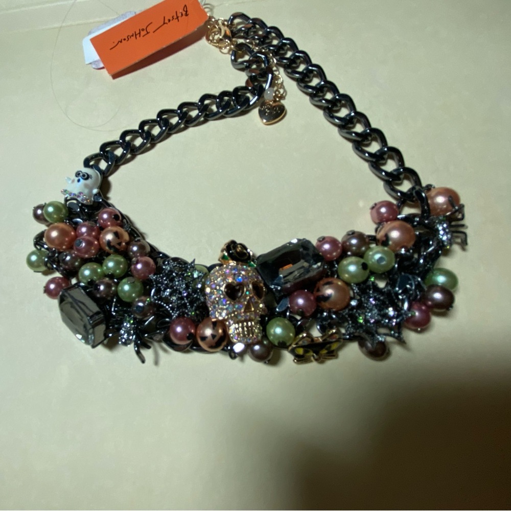 BETSY JOHNSON CRYSTAL BIB NECKLACE WITH SKULL AND PINK/GREEN DETAILING